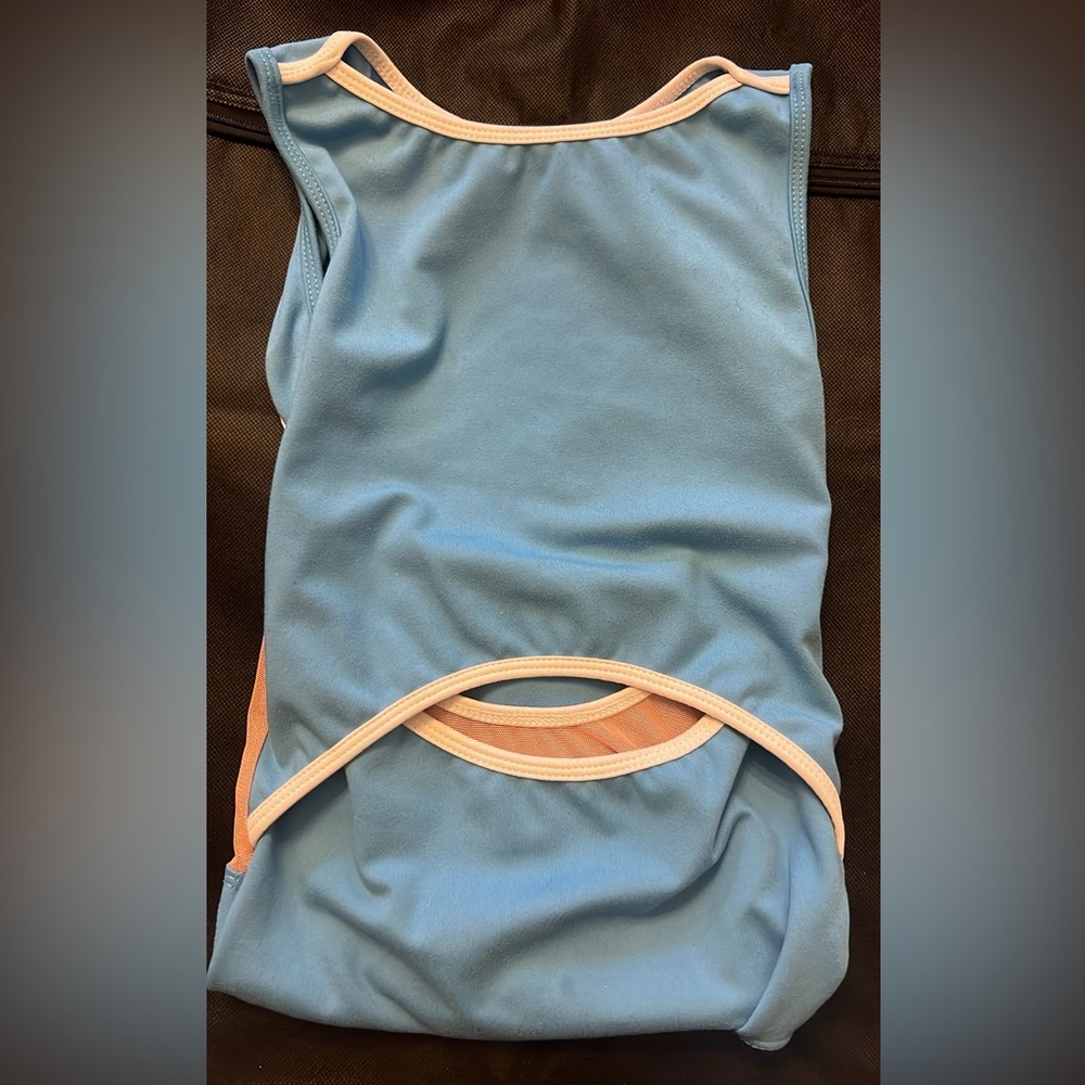 Five leotard. Pretty light blue. Cute key hole cut out in the middle. PA